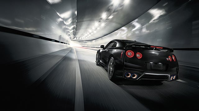 2023 Nissan GT-R seen from behind driving through a tunnel | Grainger Nissan of Beaufort in Beaufort SC